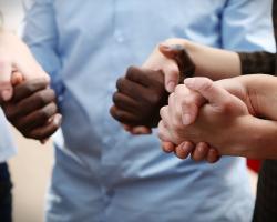 Group of people holding hands